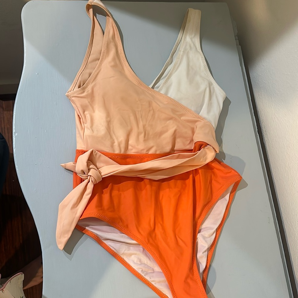 Orange and white one piece swimsuit